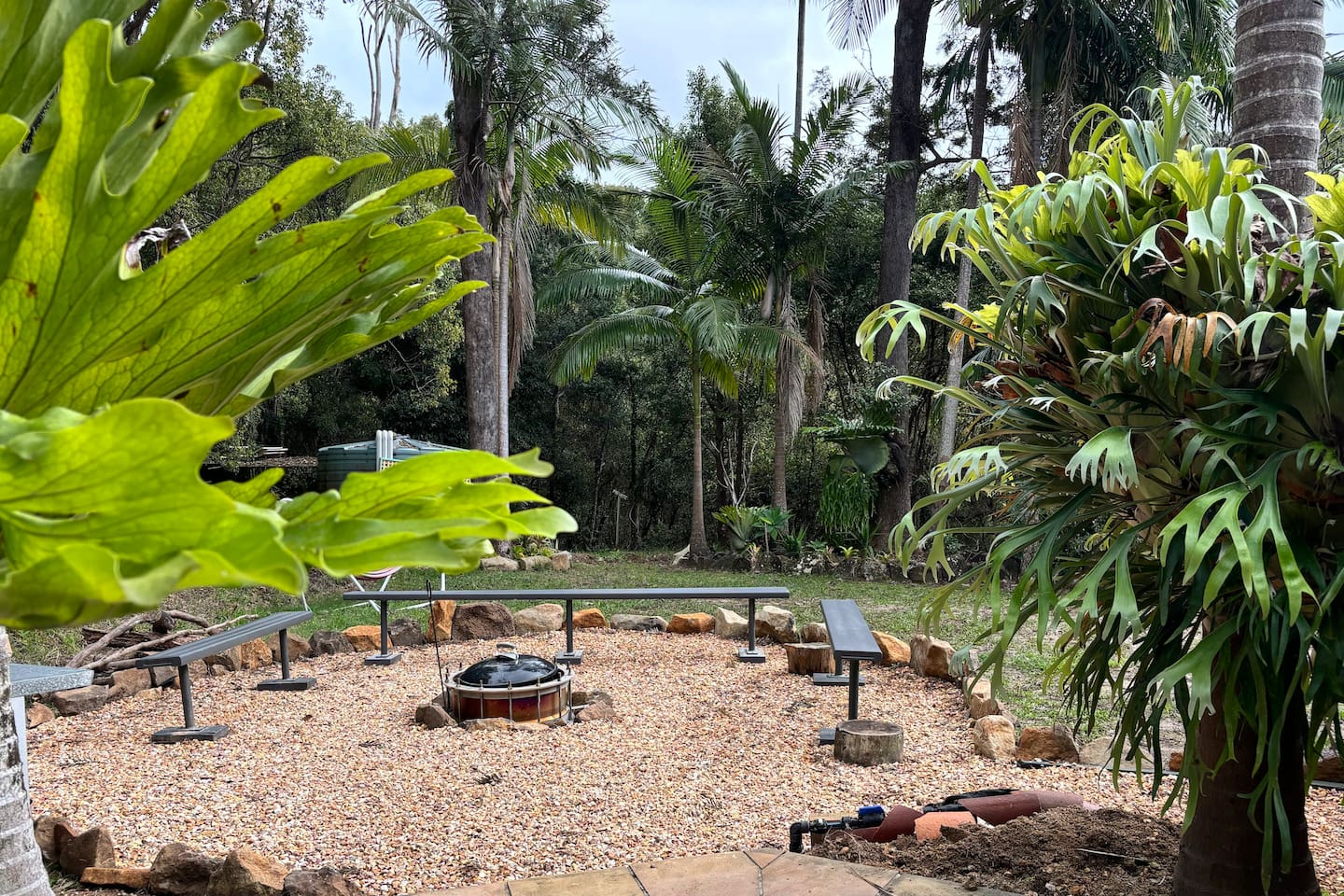 Firepit with bench seating, cushions available. 
