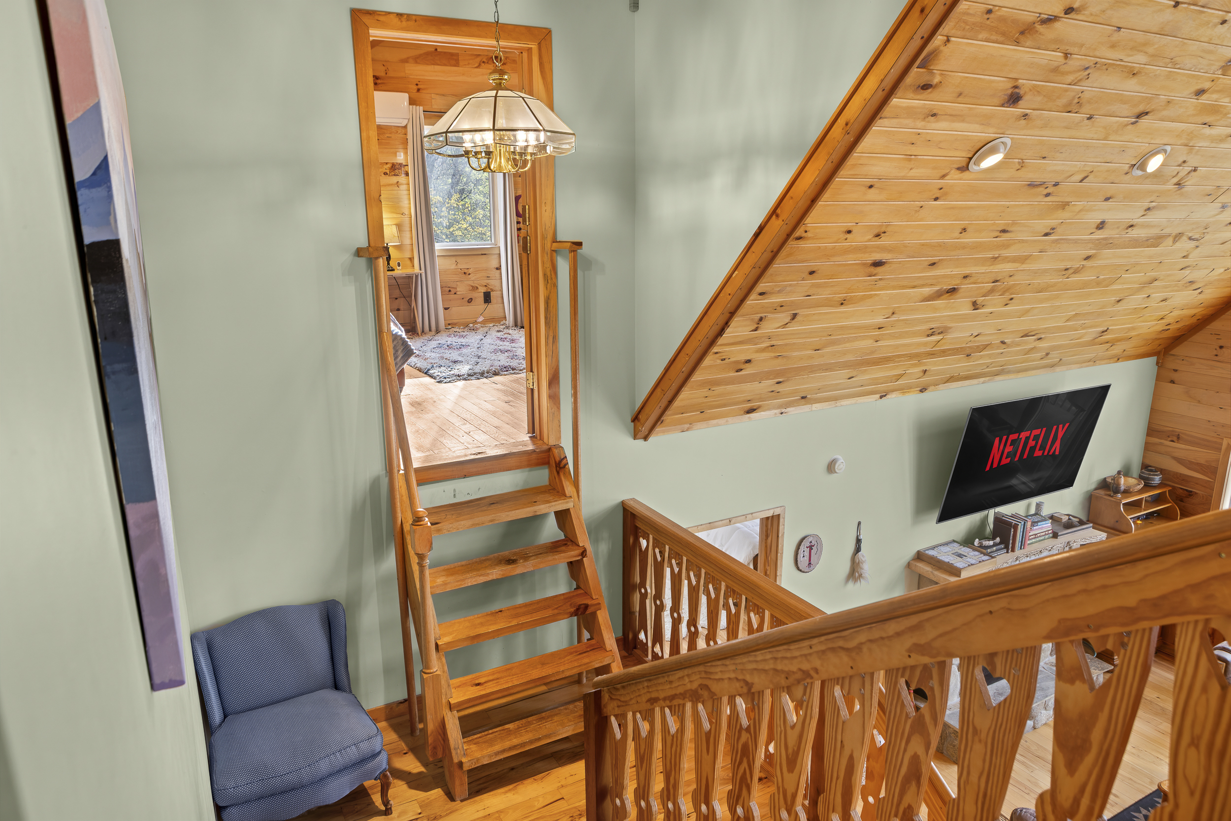 Loft Retreat: Bask in natural light and enjoy movie nights in your scenic mountain hideaway!