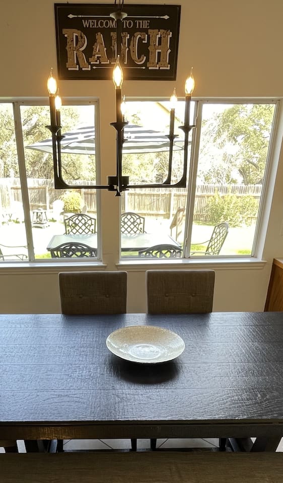 Breakfast area and adjoining kitchen  look out to backyard.  One of three dining areas, the breakfast area seats eight.  