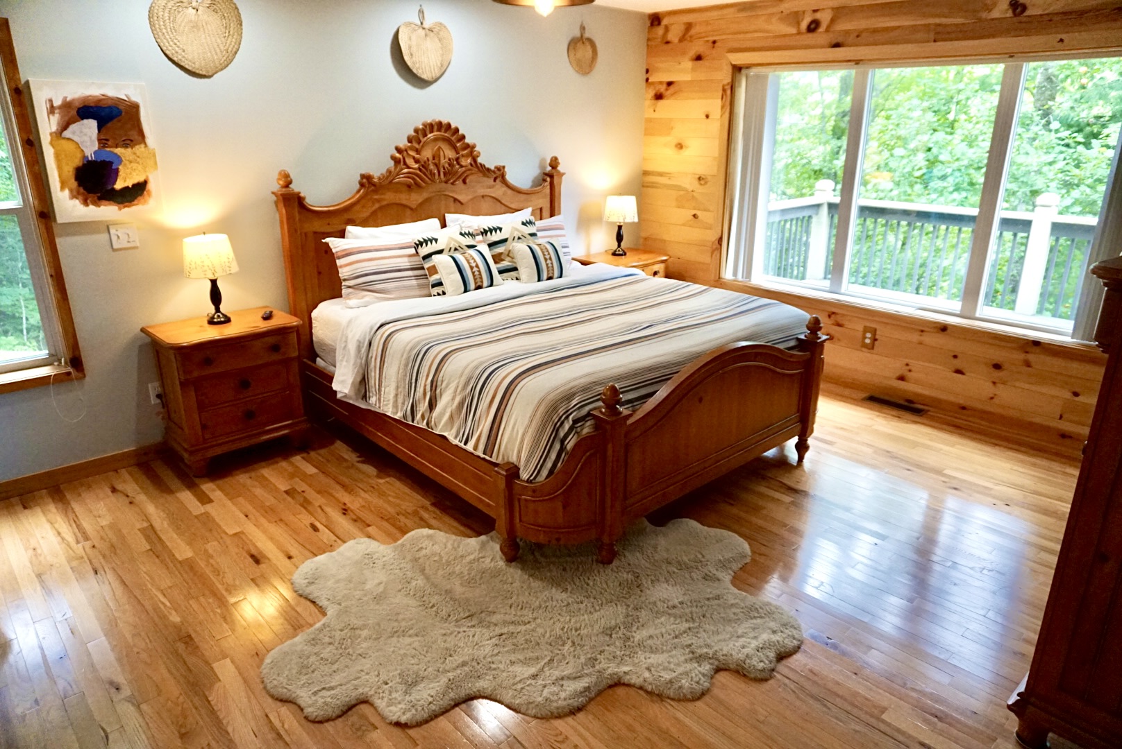 Elegant wooden furnishings and views of lush greenery await your relaxation!