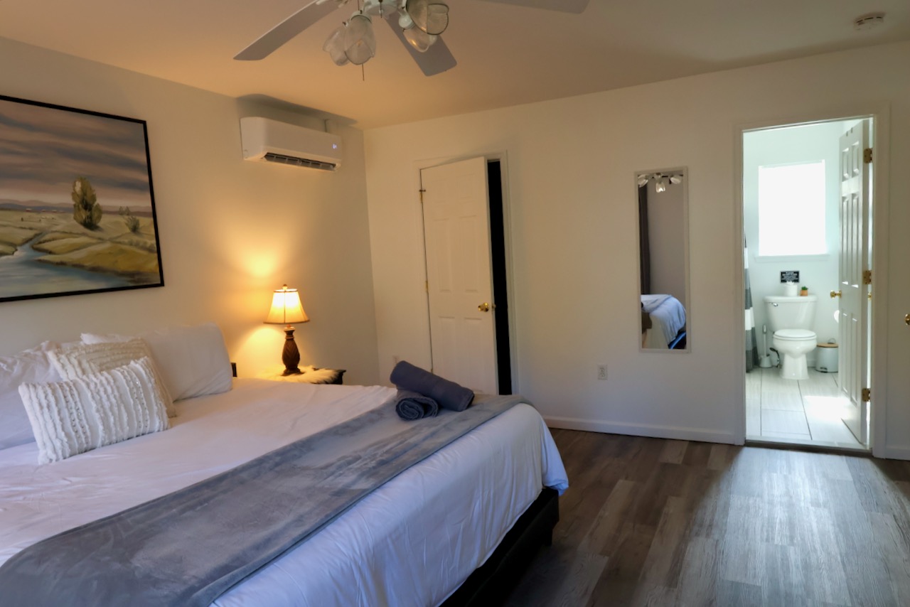 with a peak into the attached bathroom