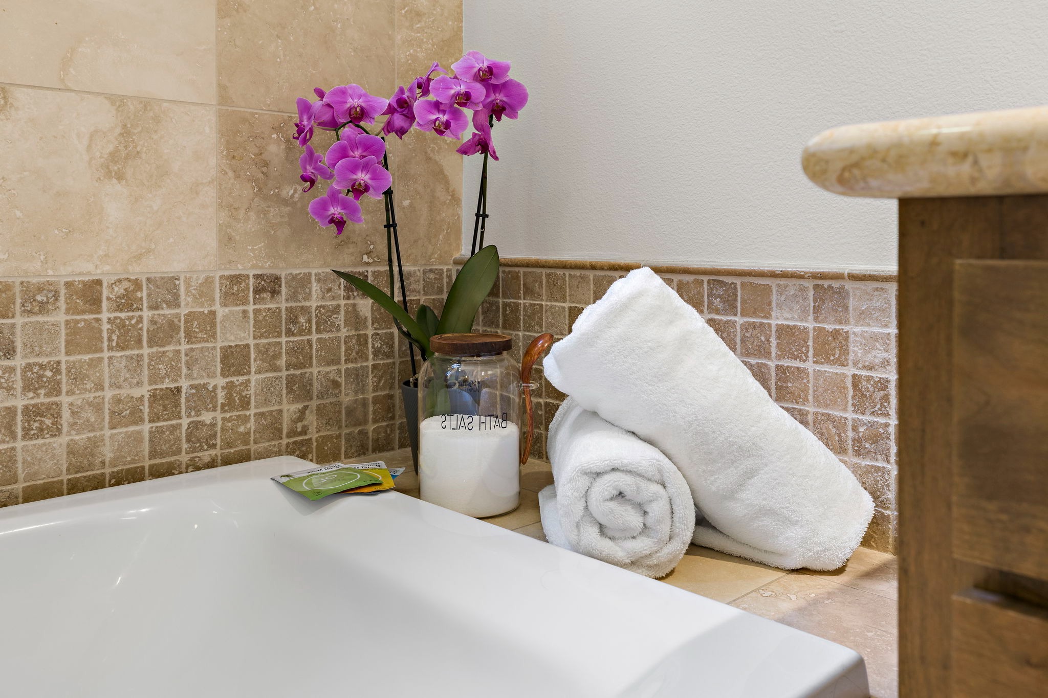 Escape with a warm bath with provided bath salts and relaxing spa music in the master bathroom.