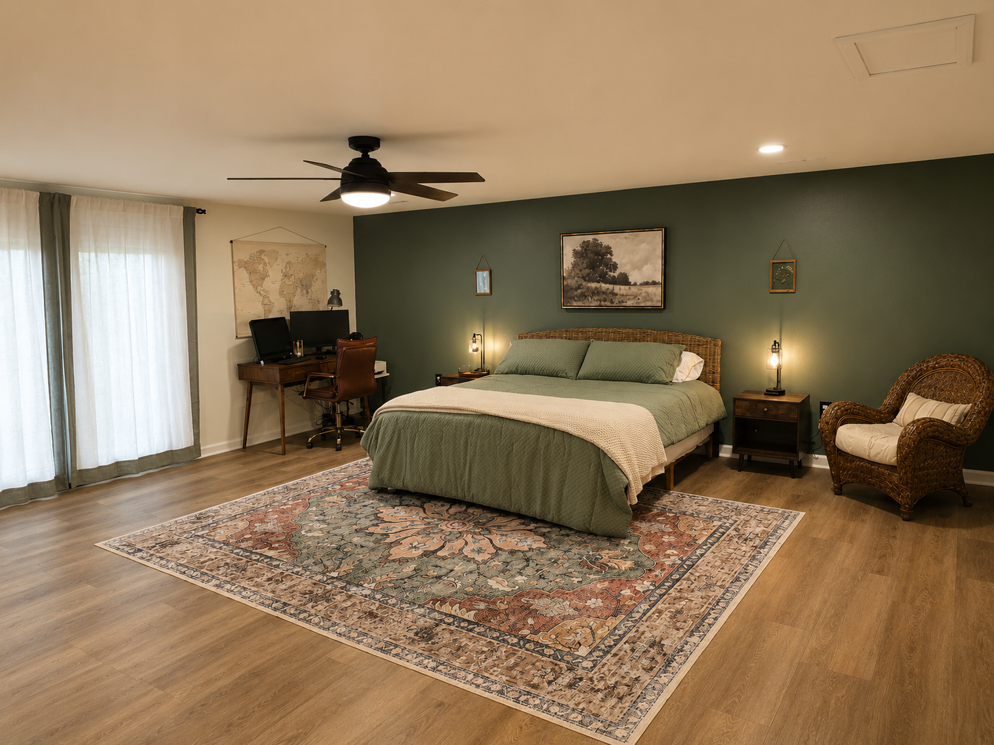 Spacious basement bedroom with a king bed, sitting area, desk space and a relaxed retreat-style feel.