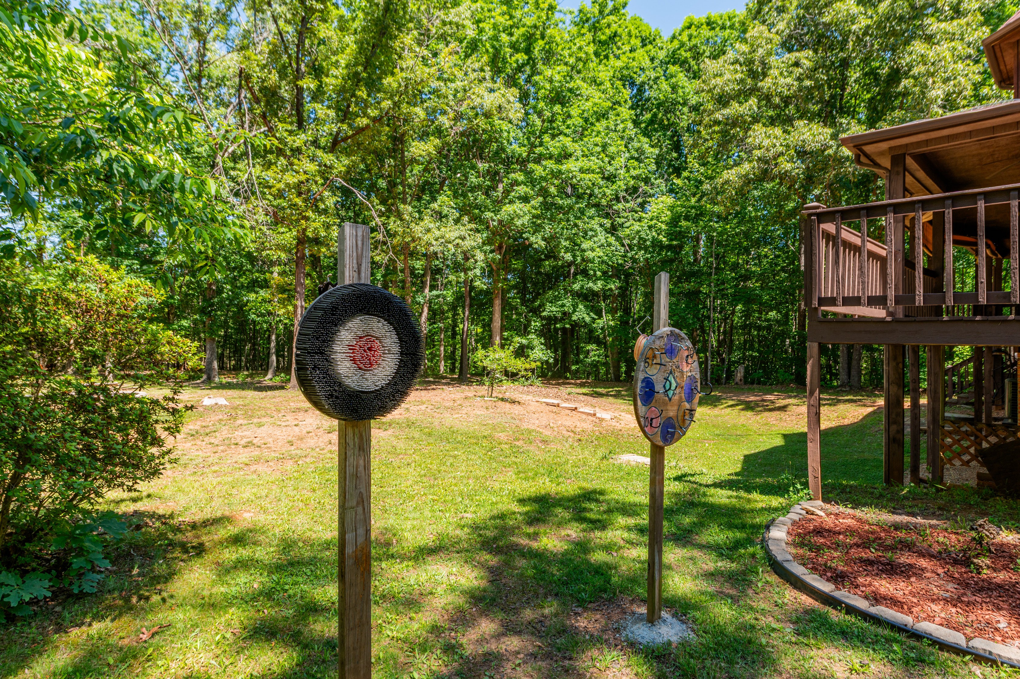 Outdoor Fun: Enjoy target practice and laughter surrounded by serene woods in delightful Dillwyn!