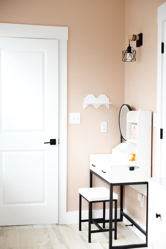 View looking toward doorway of bedroom #4 from shared toilet / shower area of bedroom #5. 