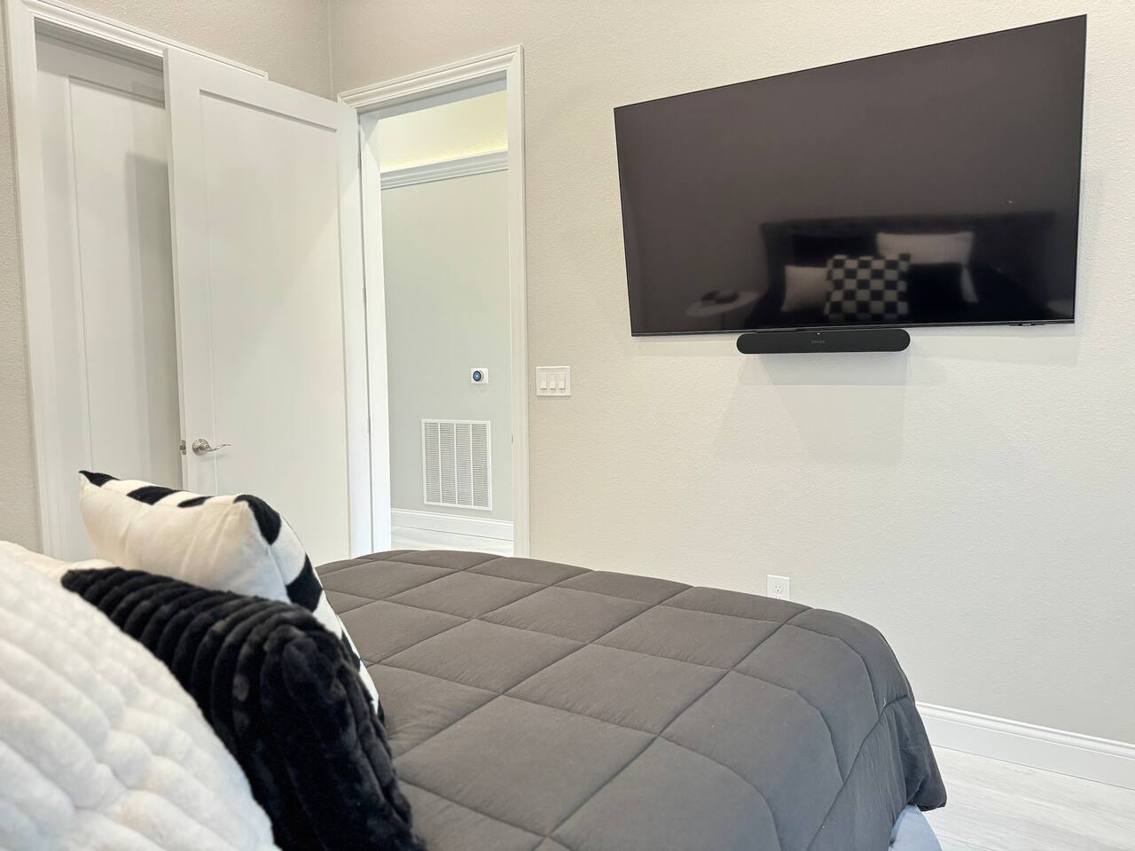 Queen size bed with TV and sound system
