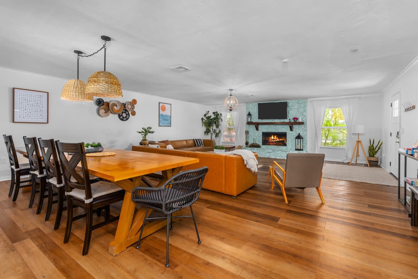 Newly decorated! Huge boho themed living room with 12-foot long custom dining table.