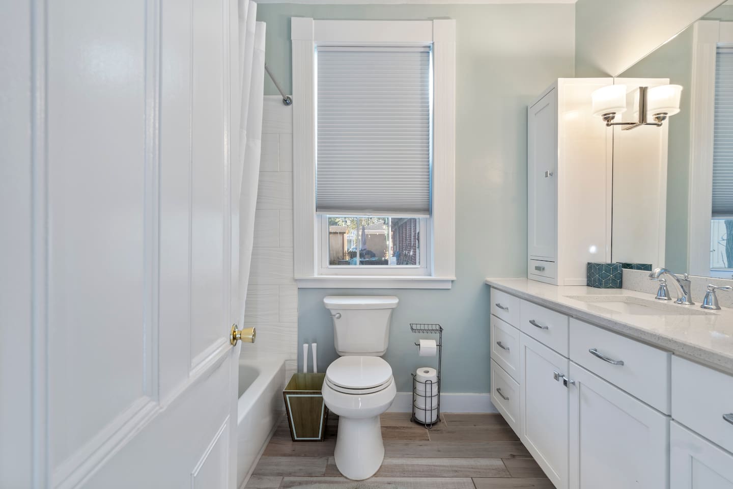 Full bathroom with tub/shower combo, updated fixtures, and clean modern finishes