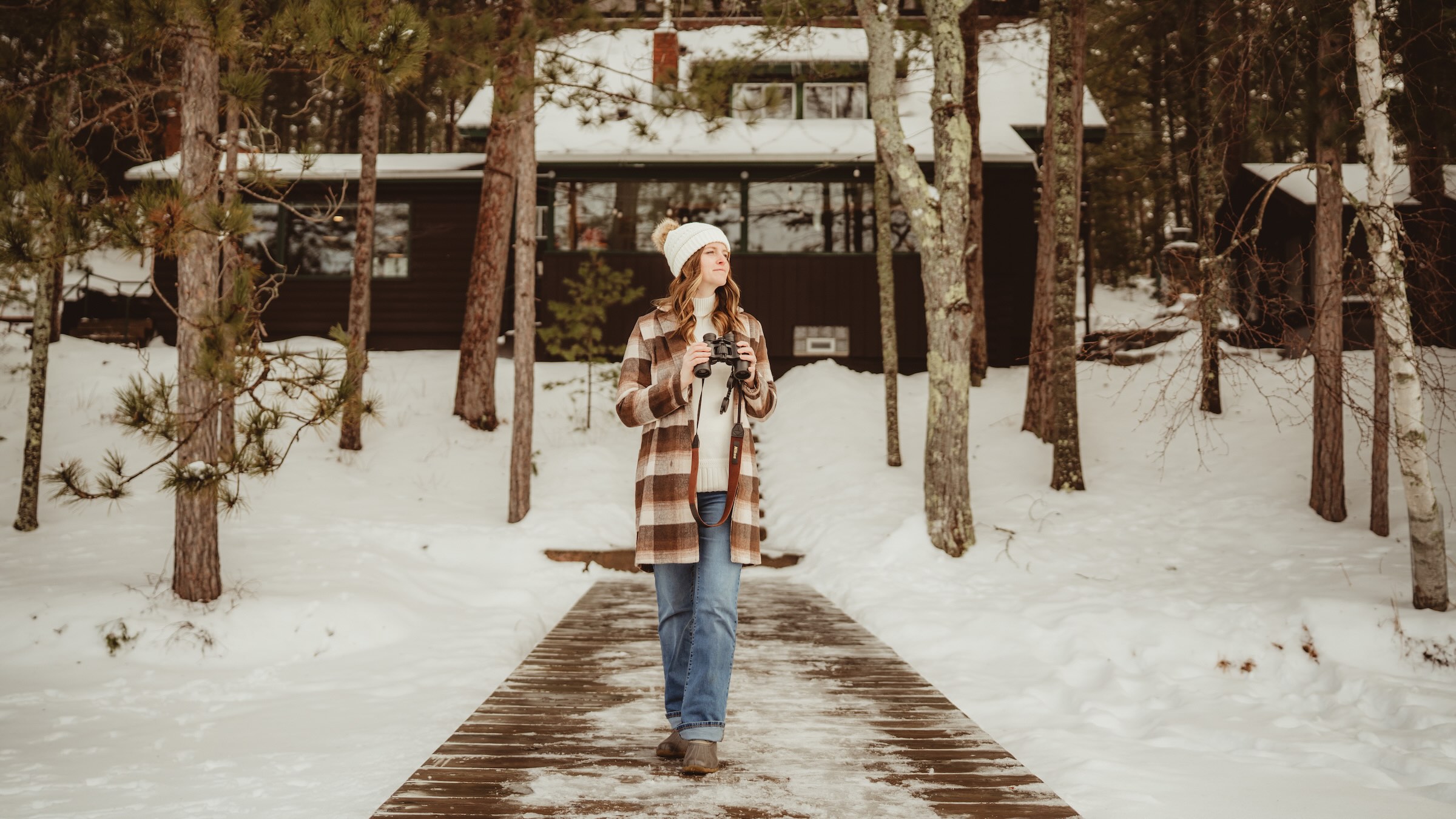 Girl walking out to the pier in winter at Dollar Lake Retreat