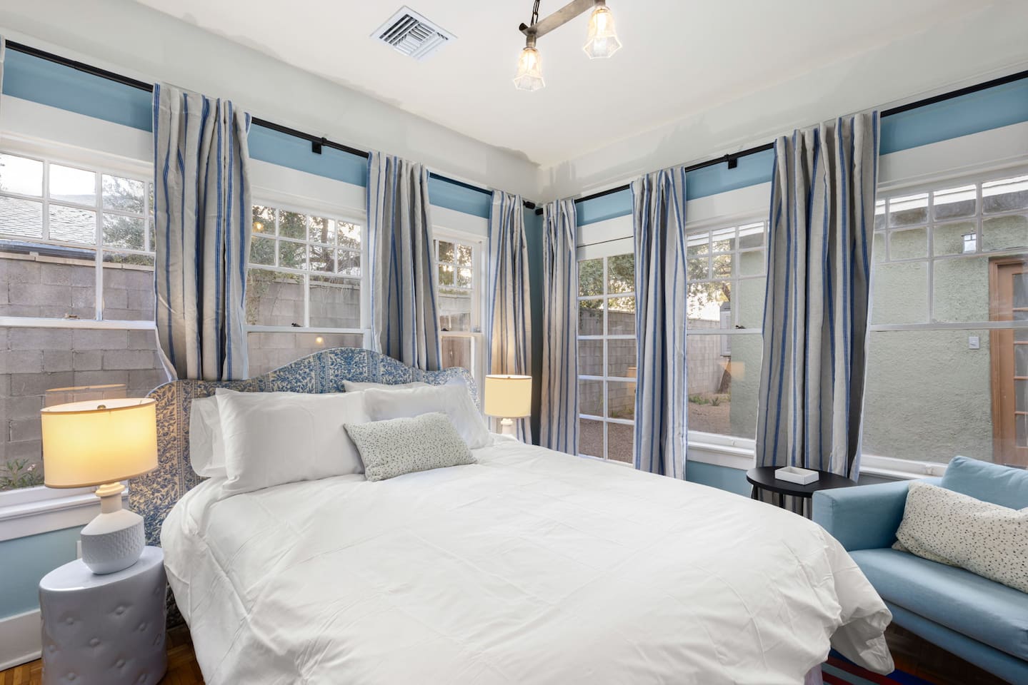 back bedroom has 5 windows and door to back patio (and blackout curtains)