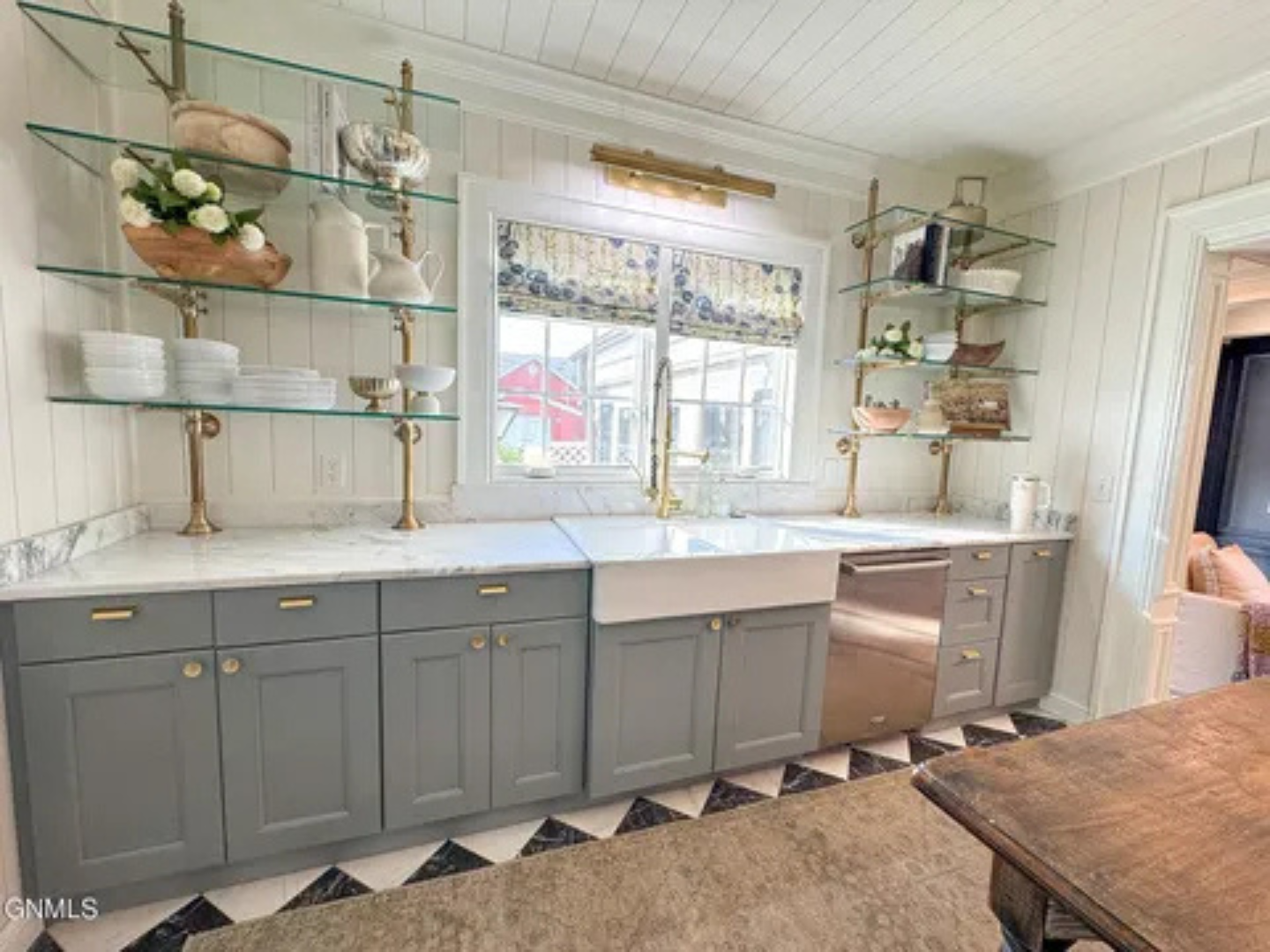 The sink area feels open and functional, with plenty of space to work comfortably.