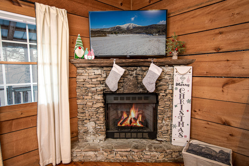 Festive decorations by the warm fireplace.