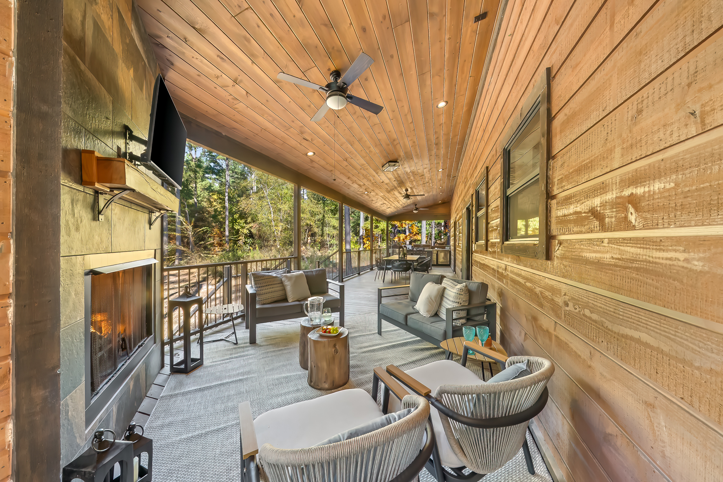 Entertainers deck thoughtfully arranged with bar, dining, and lounge zones so everyone has a perfect place to gather.