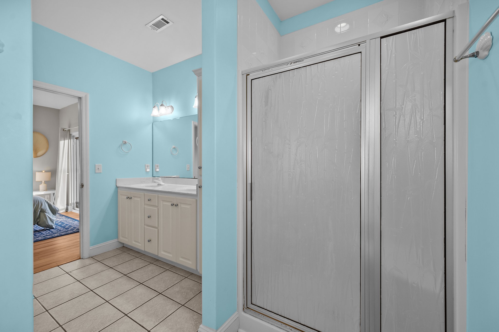 Room for two: double sinks plus a walk-in shower make mornings easy