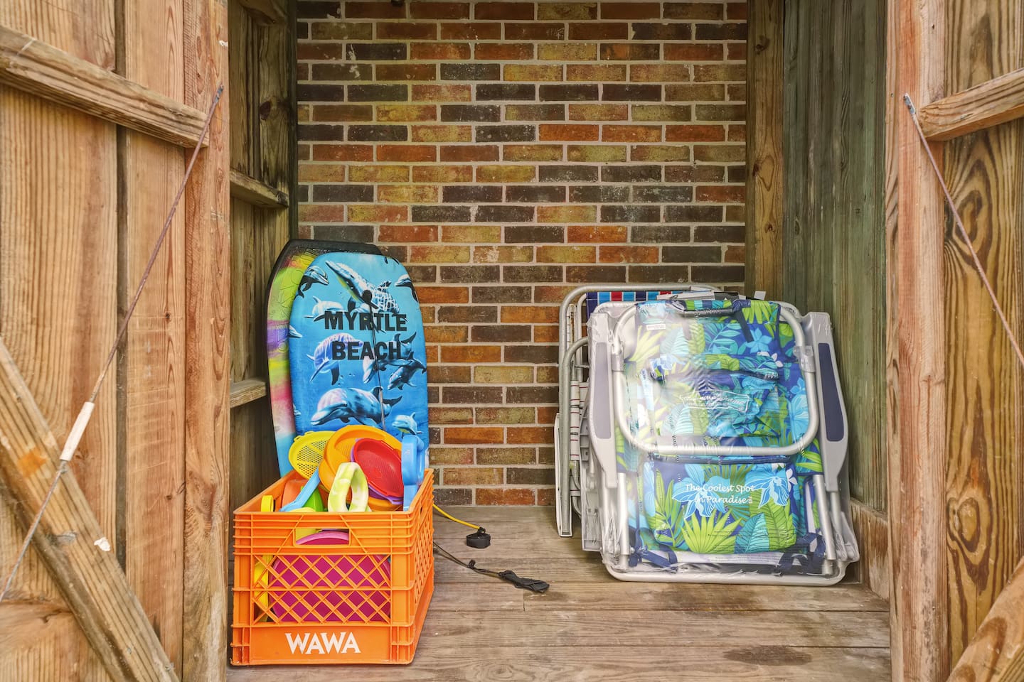 Various beach toys and beach chairs available for guests' use