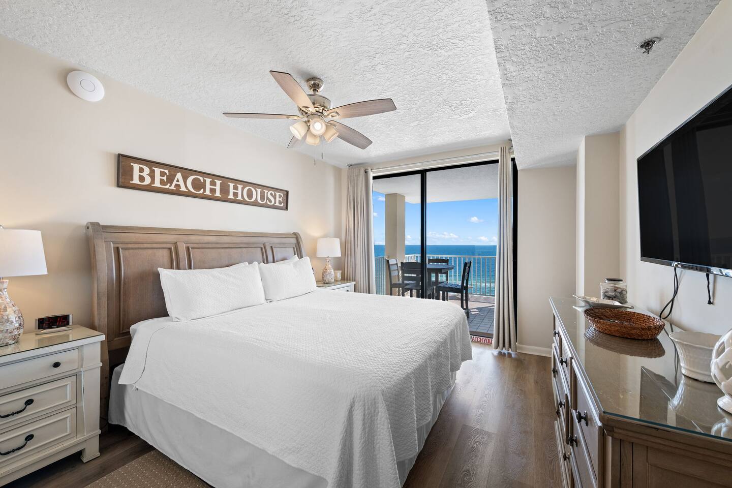 Master bedroom with large king bed - with balcony and ocean view right outside the door
