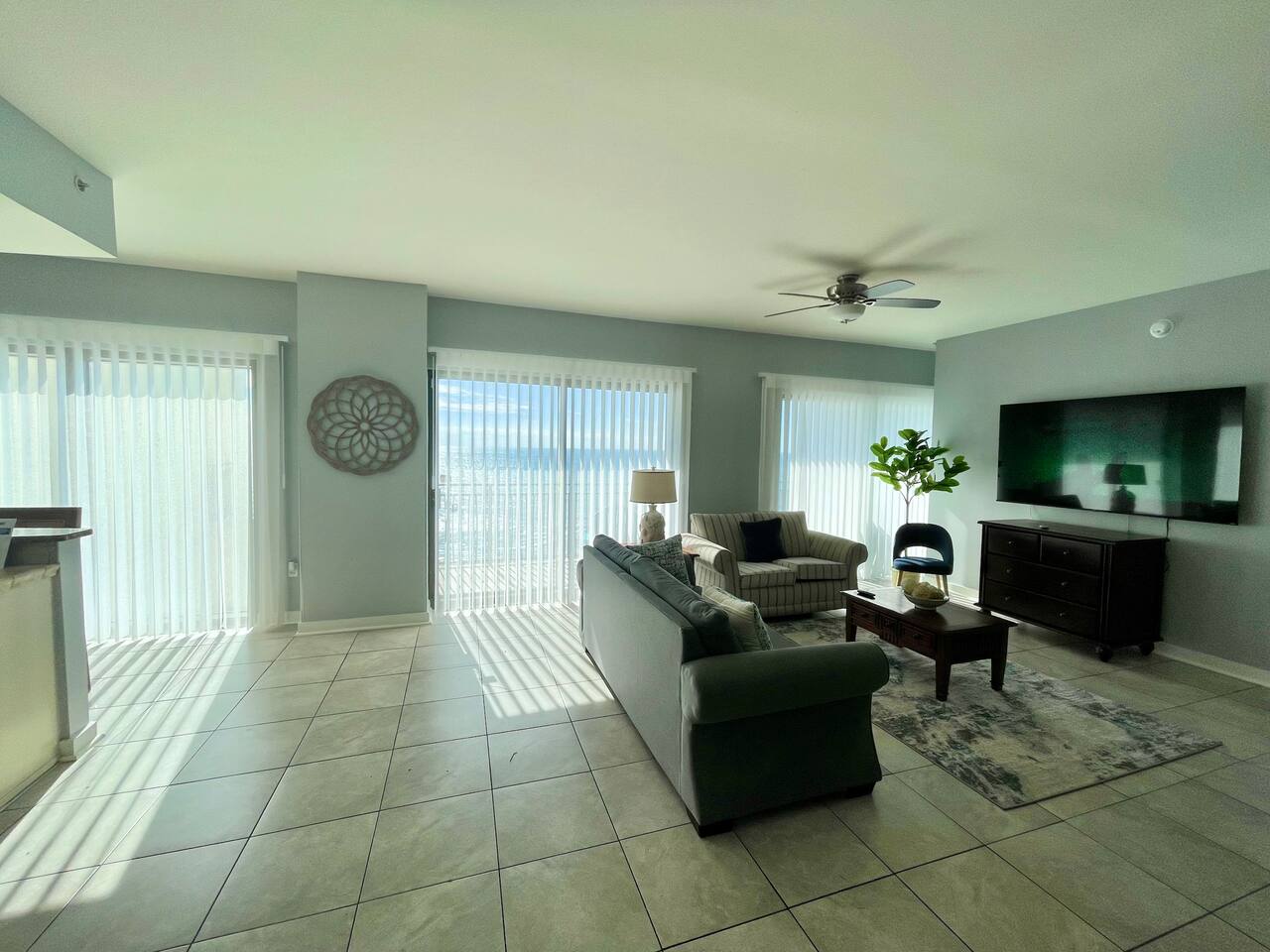 Living room with Smart blinds and  75" TV 