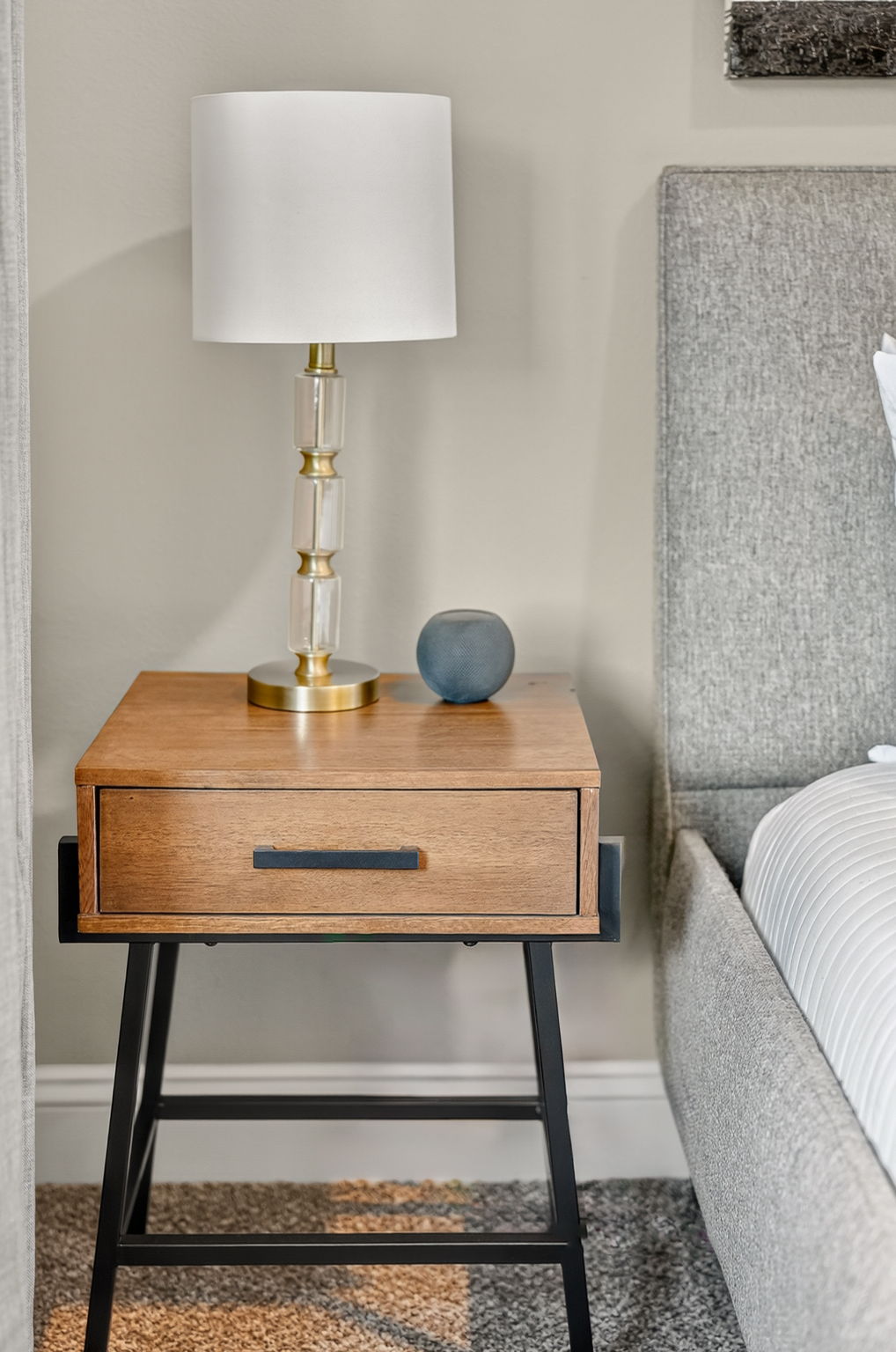 Simple décor and soft lighting for a relaxing bedroom retreat.