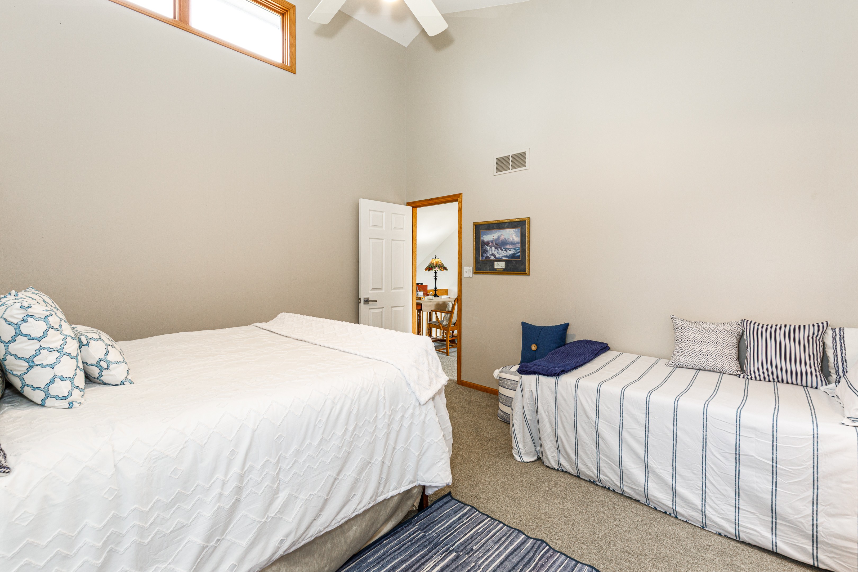Upstairs bedroom #2 features a King bed + a twin bed, ideal for those traveling with a child and an ensuite bathroom. 