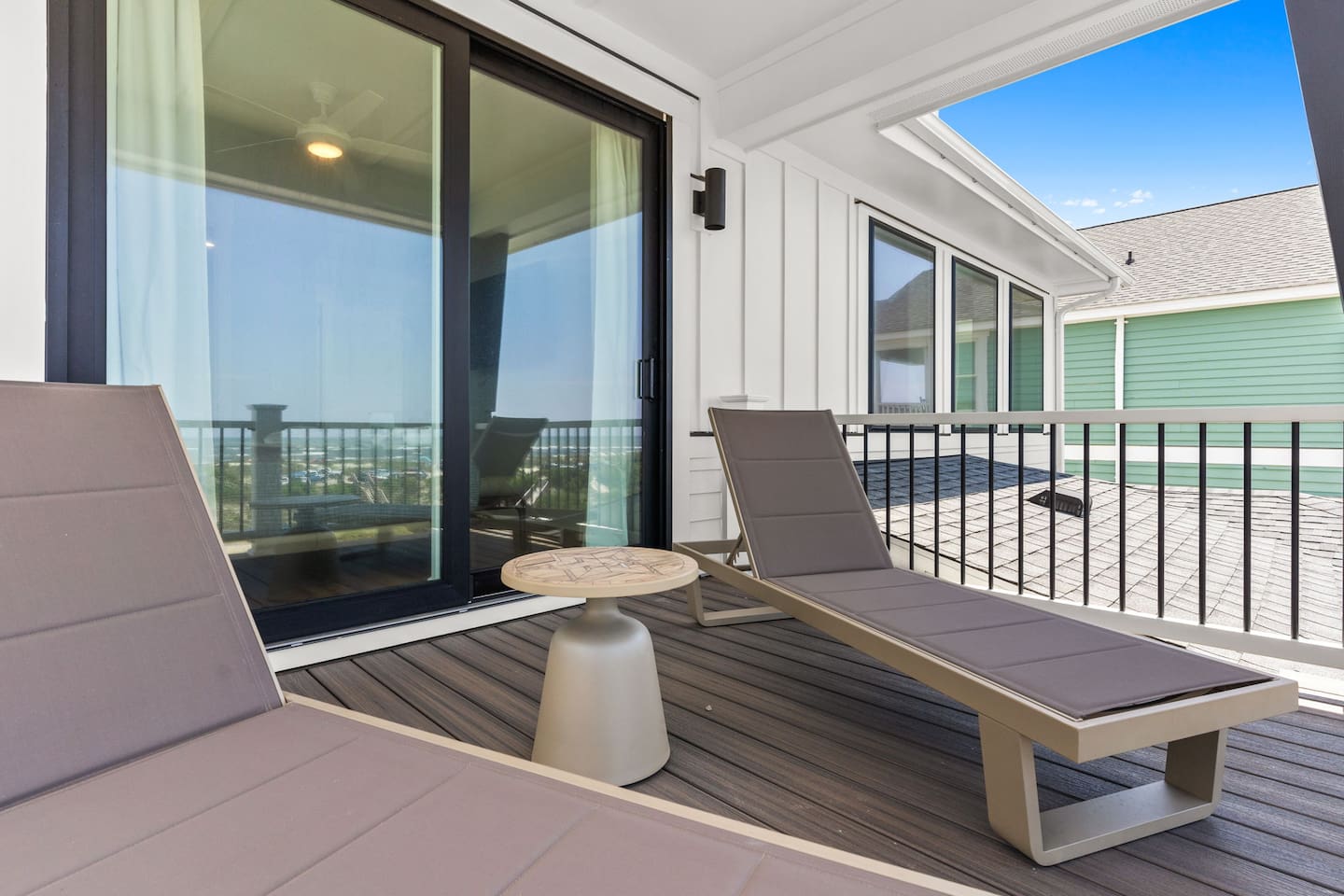 Step outside your primary suite and into your own private oasis. Relax on two chaise loungers while taking in sweeping views of the pool, beach volleyball court, and ocean beyond.