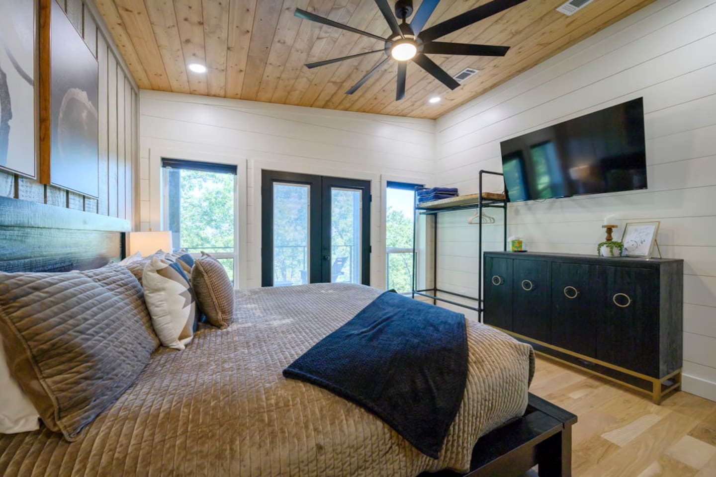 Dreamy king retreat with warm finishes and cozy Broken Bow charm.