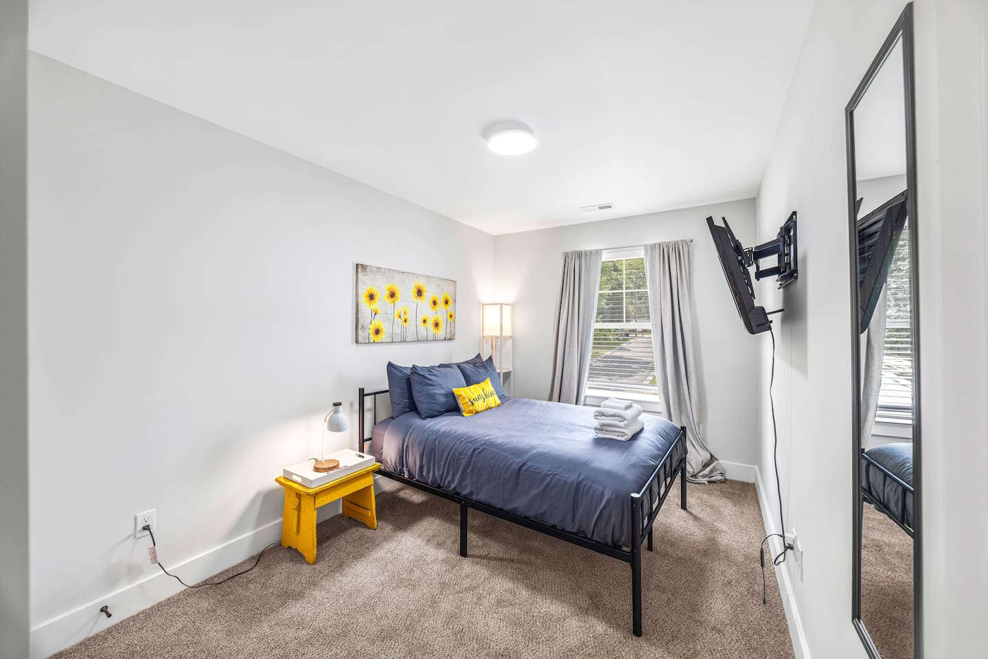 A splash of sunshine and soft linens make this double bed the perfect place to relax and recharge.