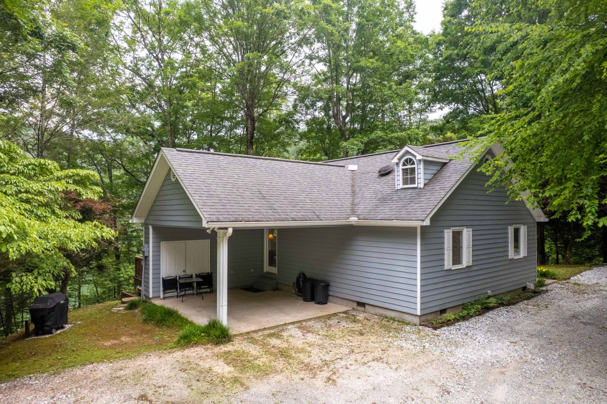 Charming Exterior: Experience serene outdoor living surrounded by lush greenery!

