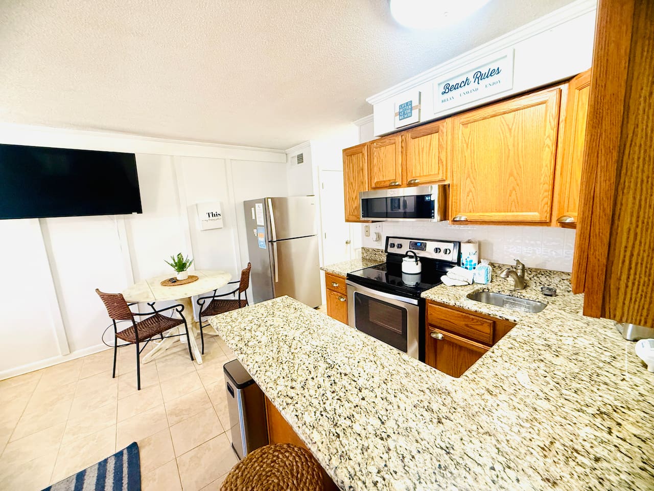 Kitchen with granite counters and breakfast bar