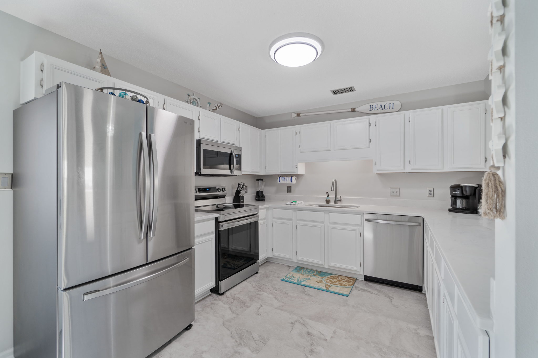 Kitchen fully stocked with modern appliances