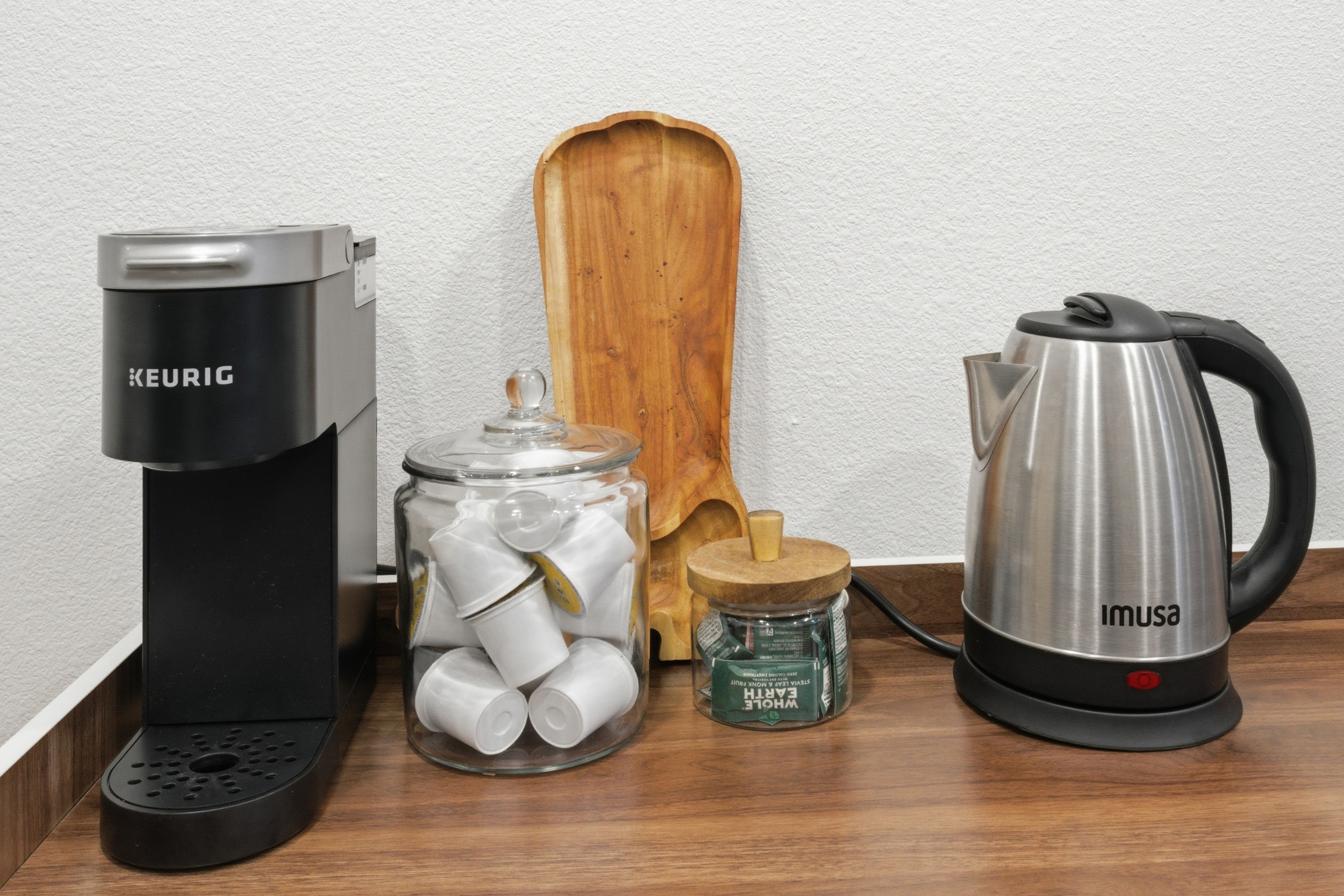 Keurig Coffee Maker and Electric Kettle on the kitchen counter. Fully stocked beverage station for every guest.