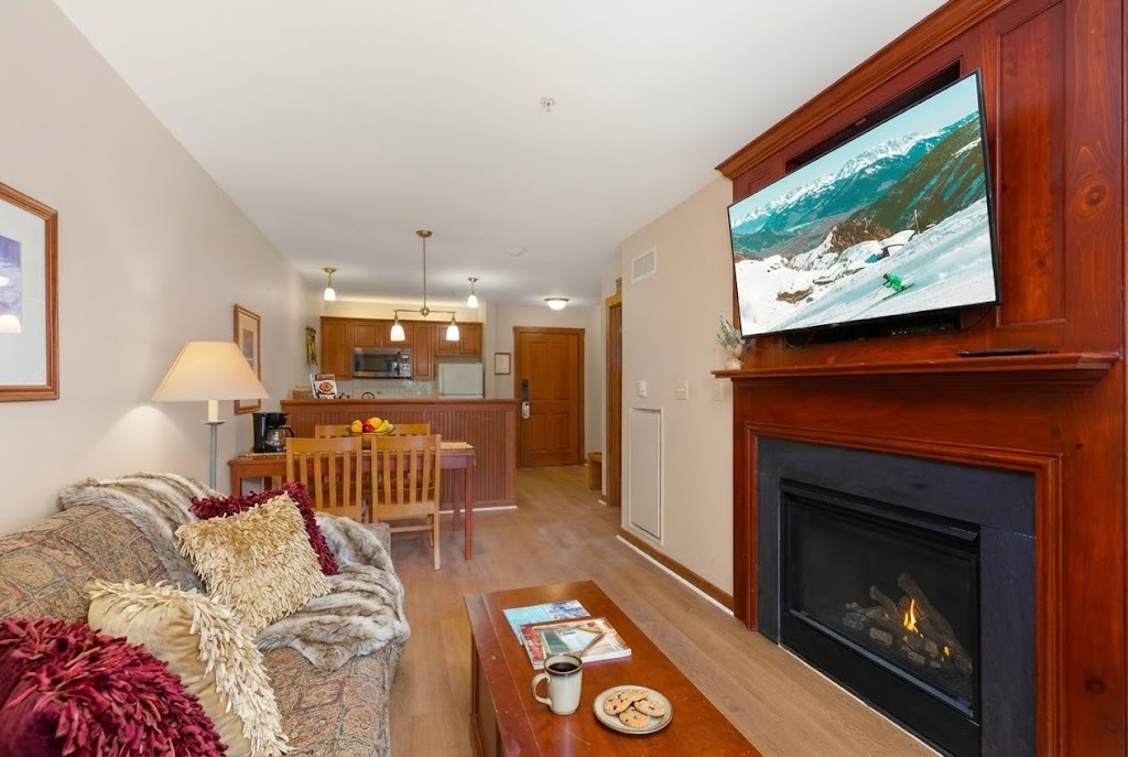 Cozy up by the fireplace in this inviting living room.