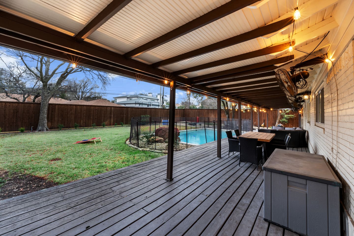 Enjoy al fresco meals rain or shine under the covered patio with seating for eight.
