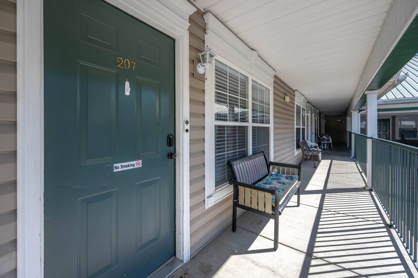Our unit is located upstairs. The balcony area has bench seating. 