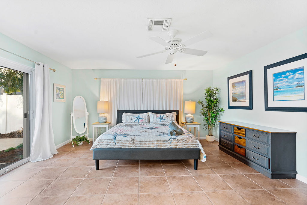 the smart TV in the master bedroom  allows guests to unwind to their favorite show.