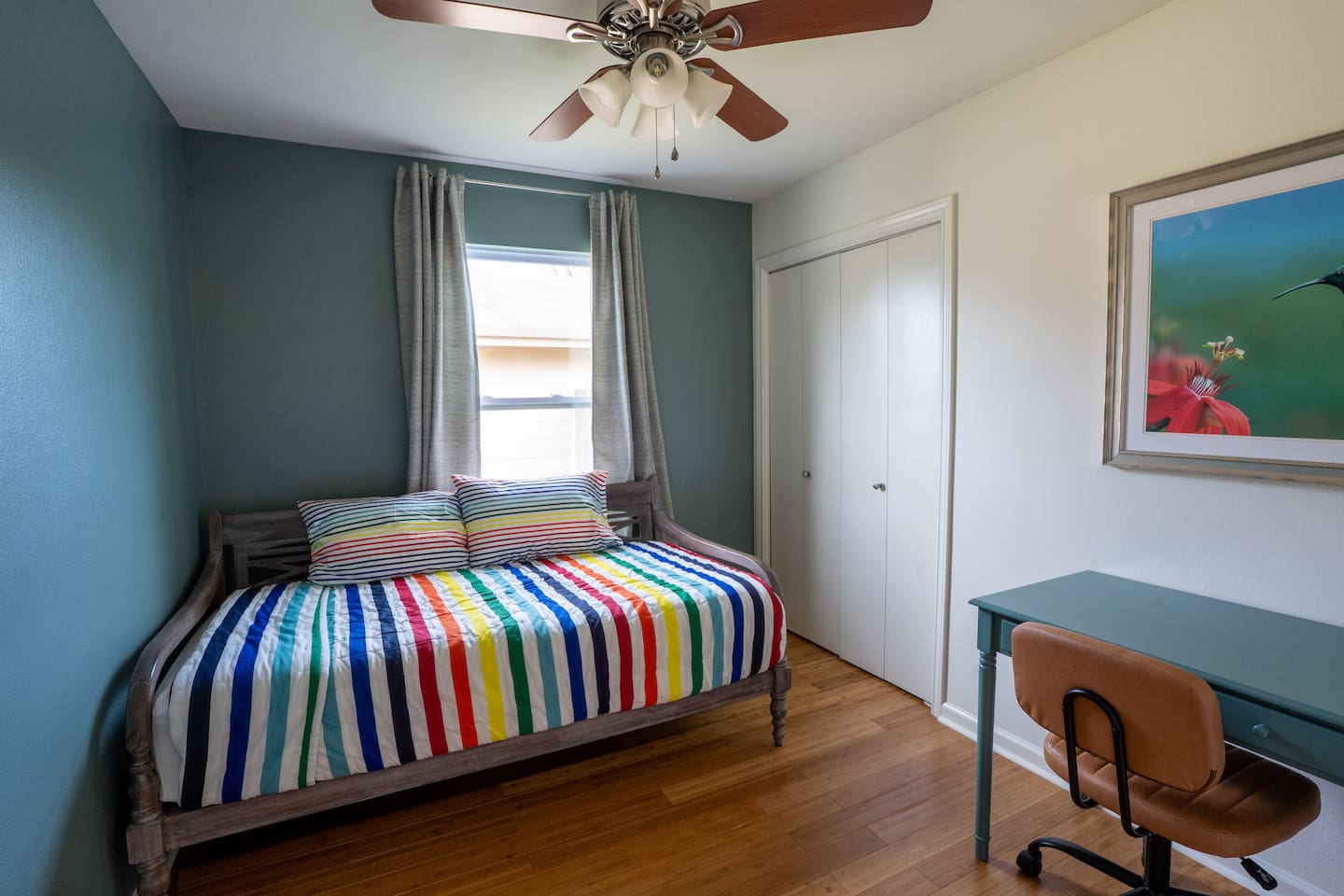 bedroom 3 has 2 single beds, one work space