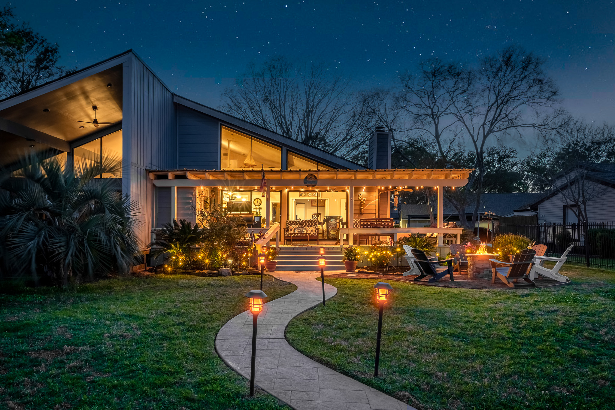 Follow the glow to your private lakeside retreat—where cozy nights, twinkling lights, and fireside memories await under the stars.