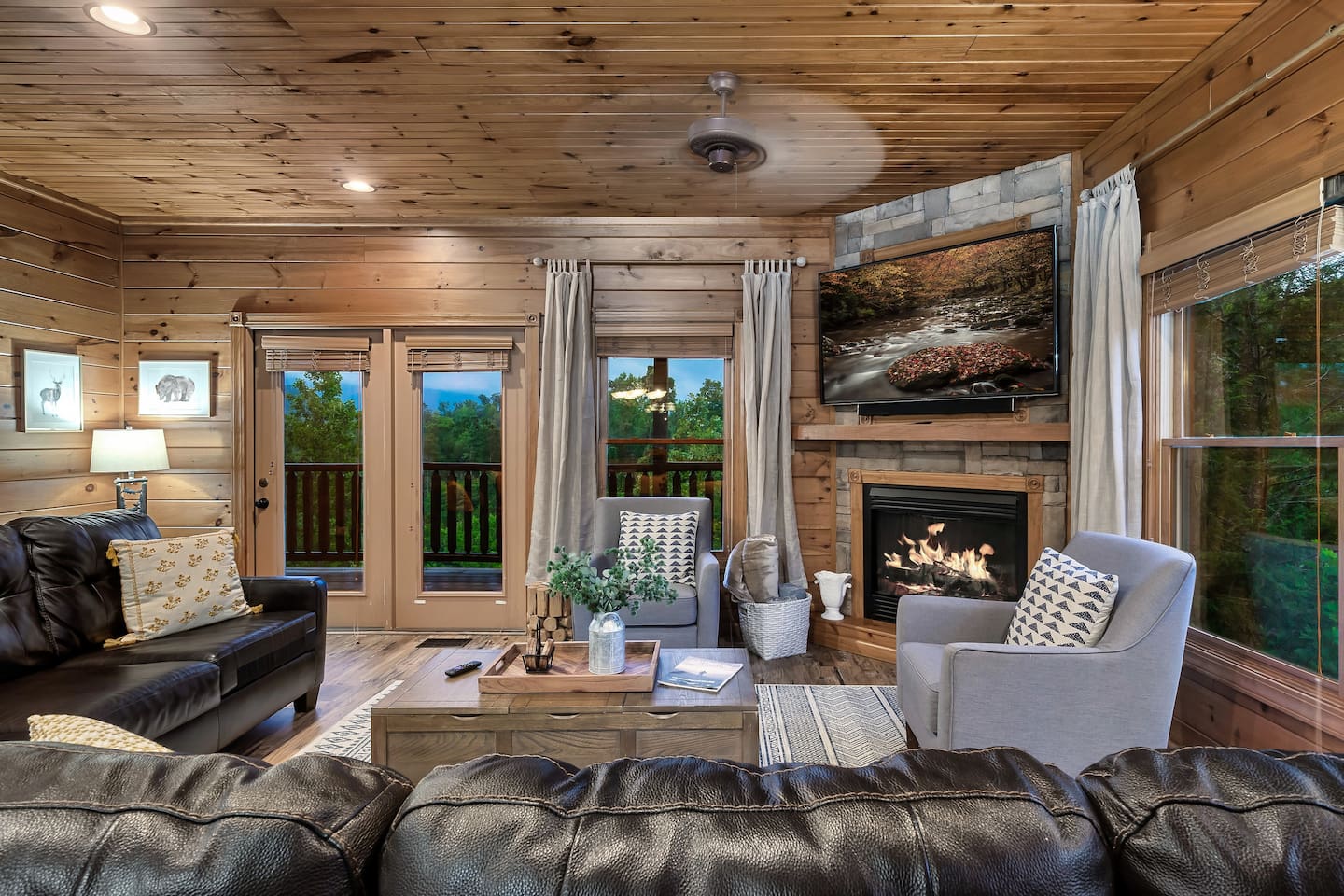 The main living room, a beautiful space to gather, play games, watch a movie & enjoy the view! | Opens to the mid-level porch