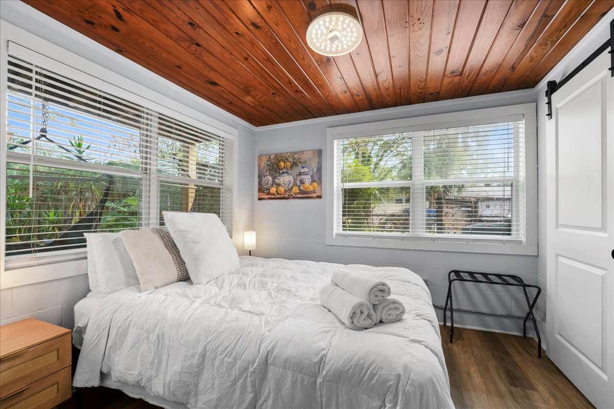 Extra comfy queen size bed and wood ceilings add to the romantic feel of the unit