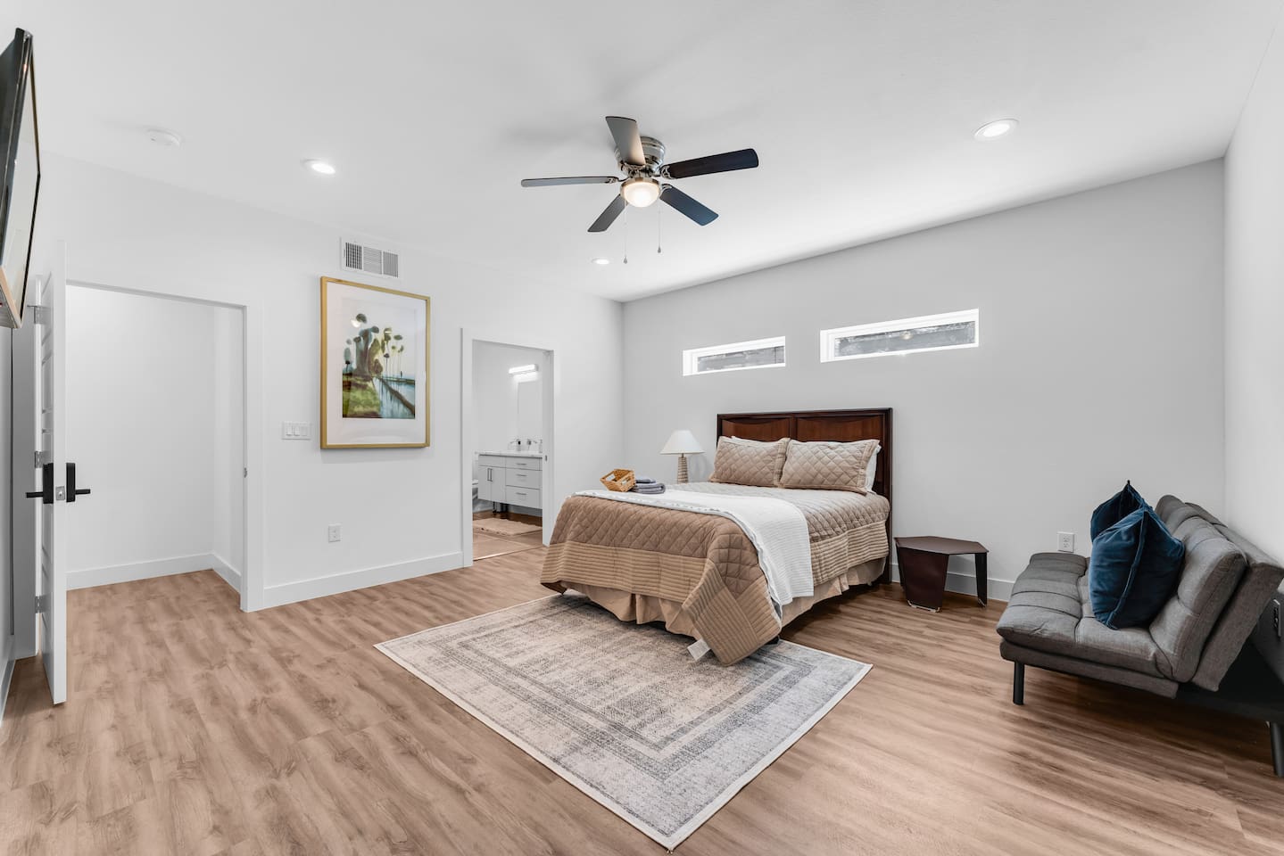 Spacious primary bedroom designed for comfort and relaxation.