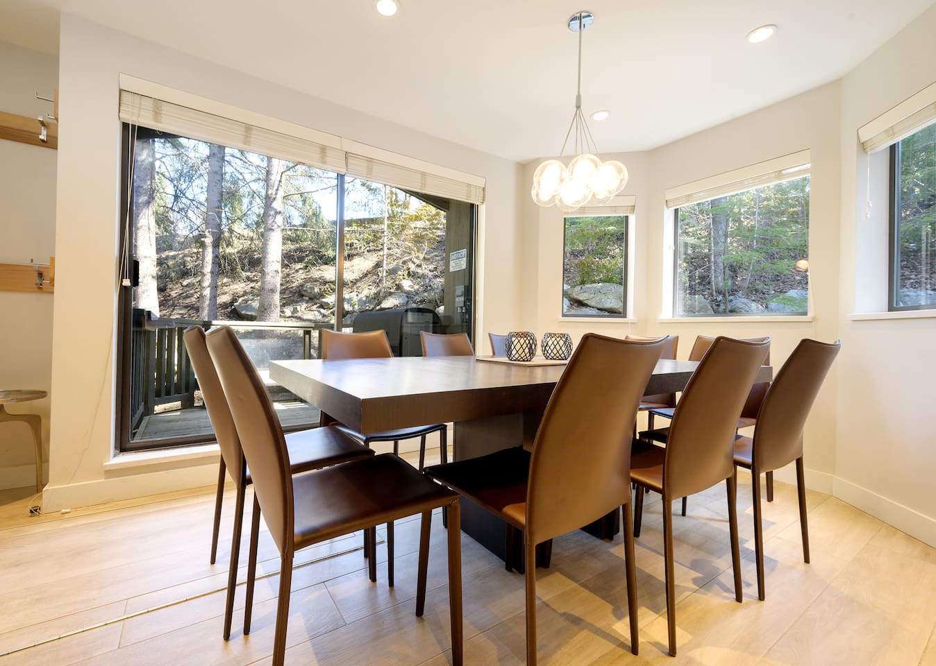 Dining area is surrounded by windows & includes a walk out patio w/ views of Blackcomb.  Dining table seats 10 people and is so close to slopes, you can ski home for lunch. *New in 2024 we upgraded to a custom built Live-Edge Maple Wood Table  