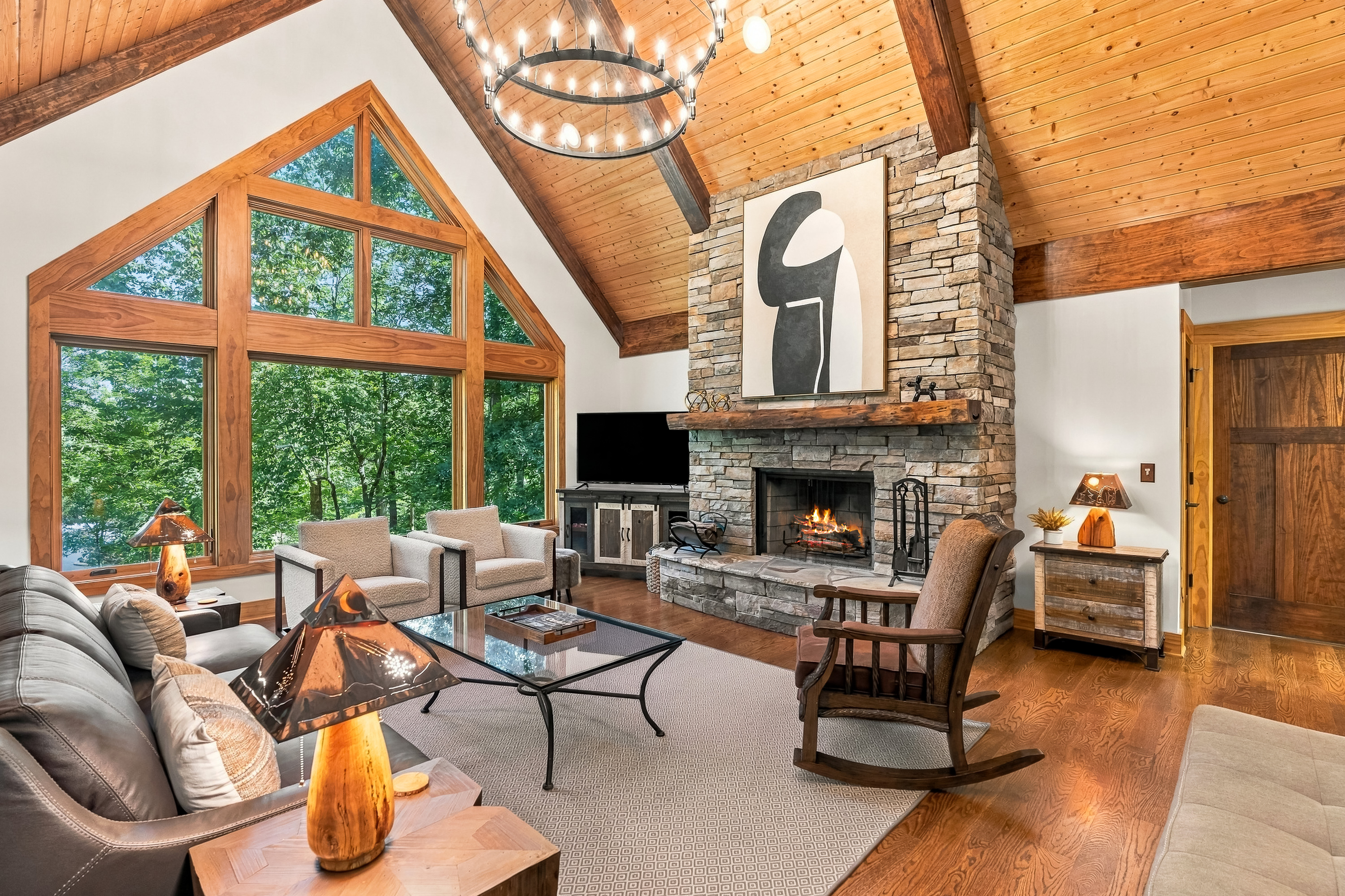 Beautiful living room with large stone, gas fireplace