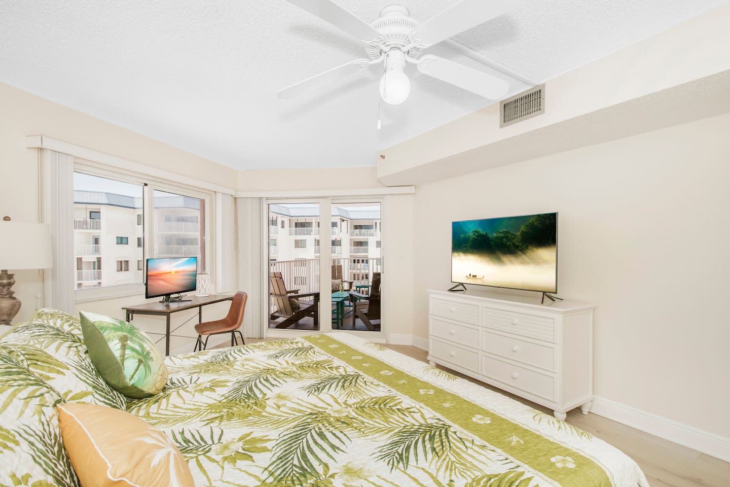 King size master bedroom with pool/gulf views and patio access. 