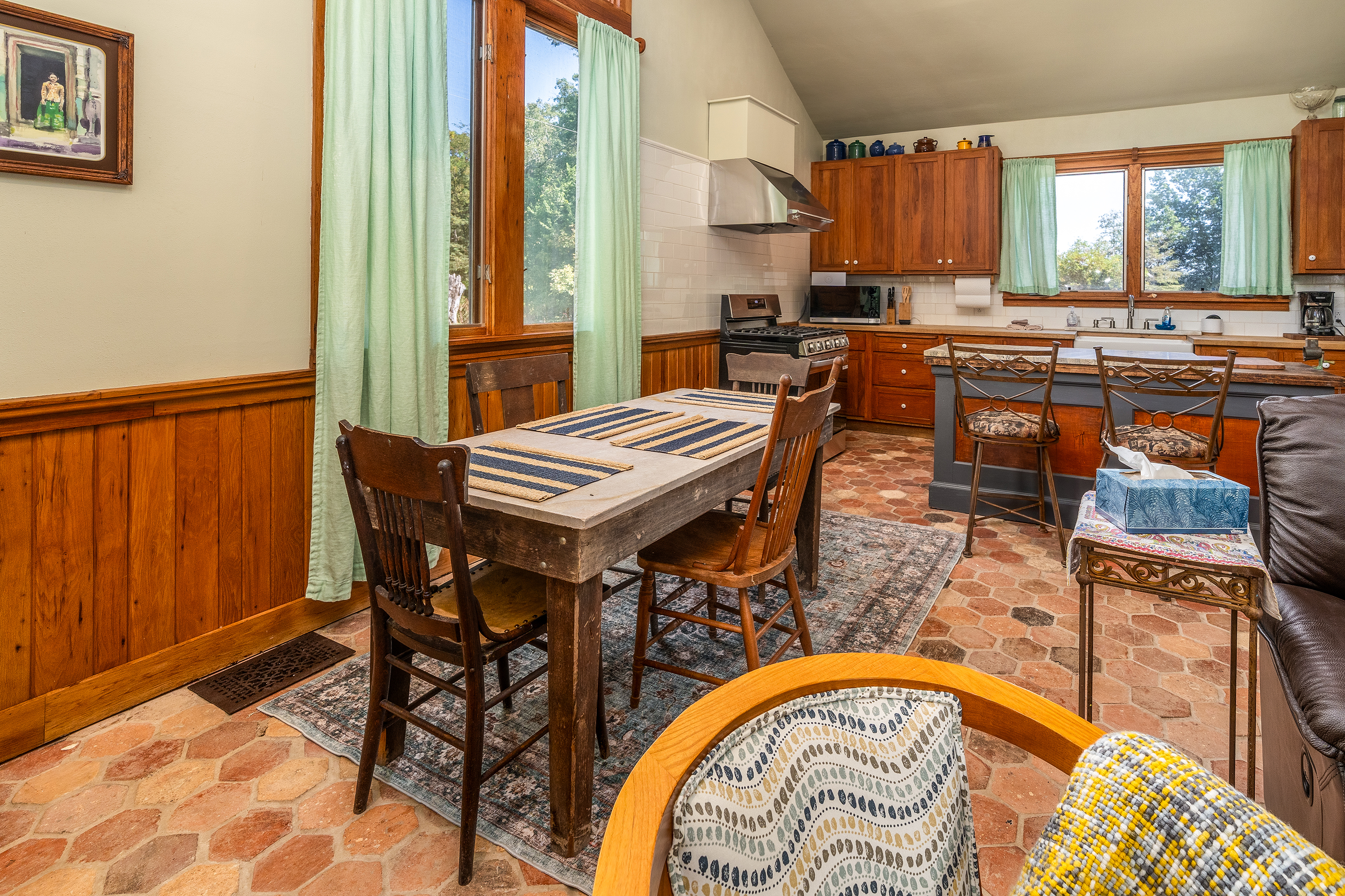 Concrete dining table with seating for four, blending rustic charm with modern style.