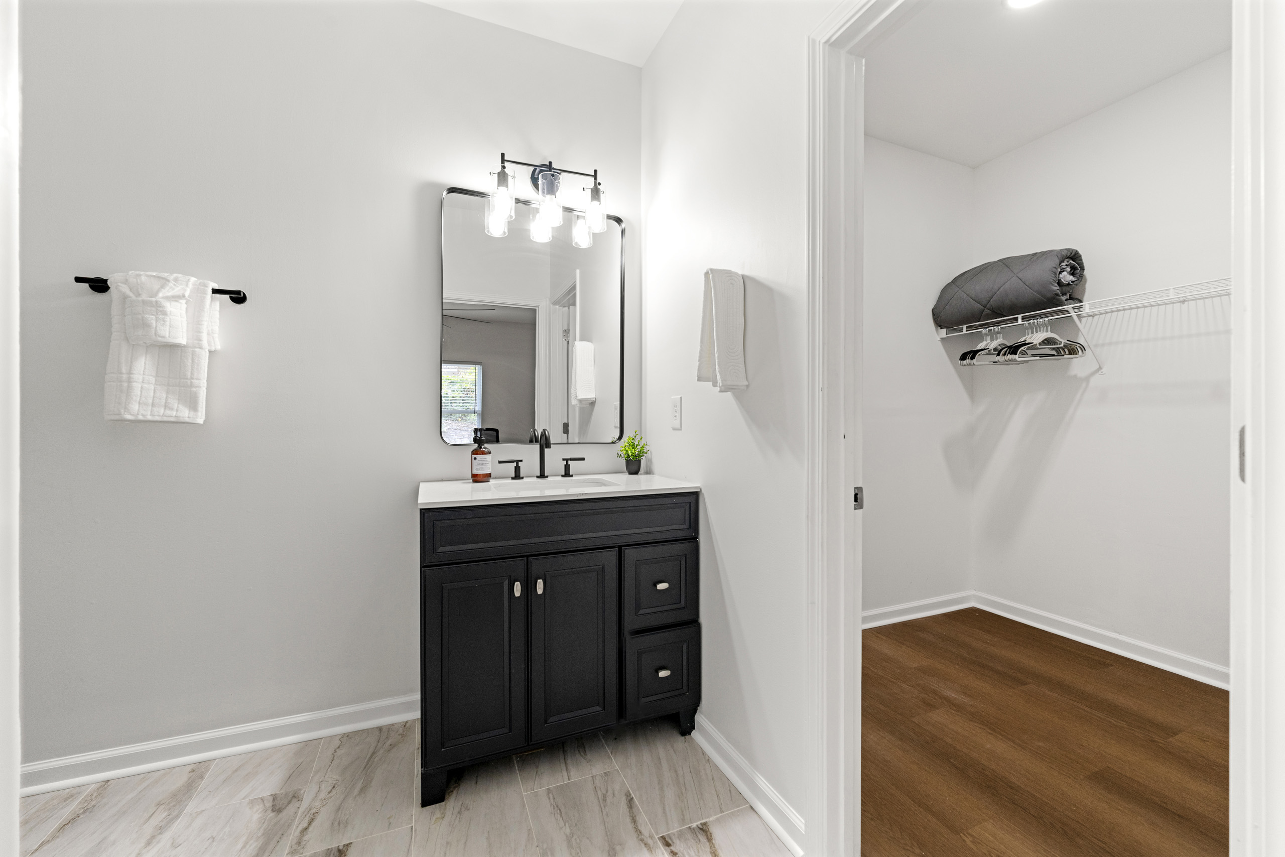 Modern bathroom stocked with fresh towels and everyday essentials.