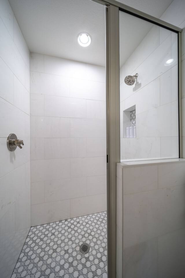The ensuite features a walk-in marble shower and private toilet area, separated from the vanity for added privacy. This layout allows two guests to comfortably use the space at once. Shampoo, conditioner, and body wash are provided for your stay.