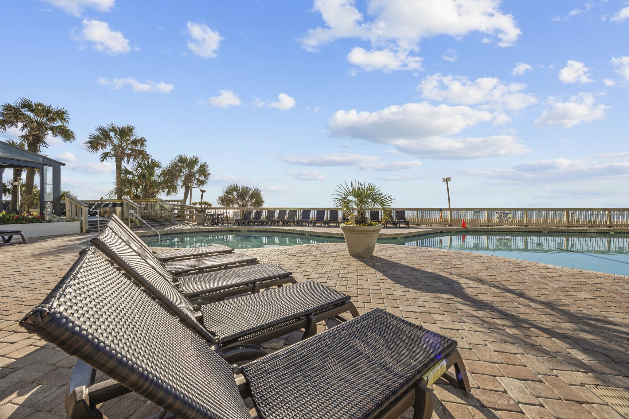 Relax poolside in the resort sun loungers 