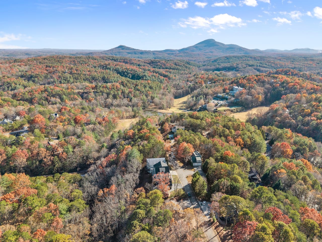 View of the property, beautifully nestled against the mountains—experience breathtaking scenery from above