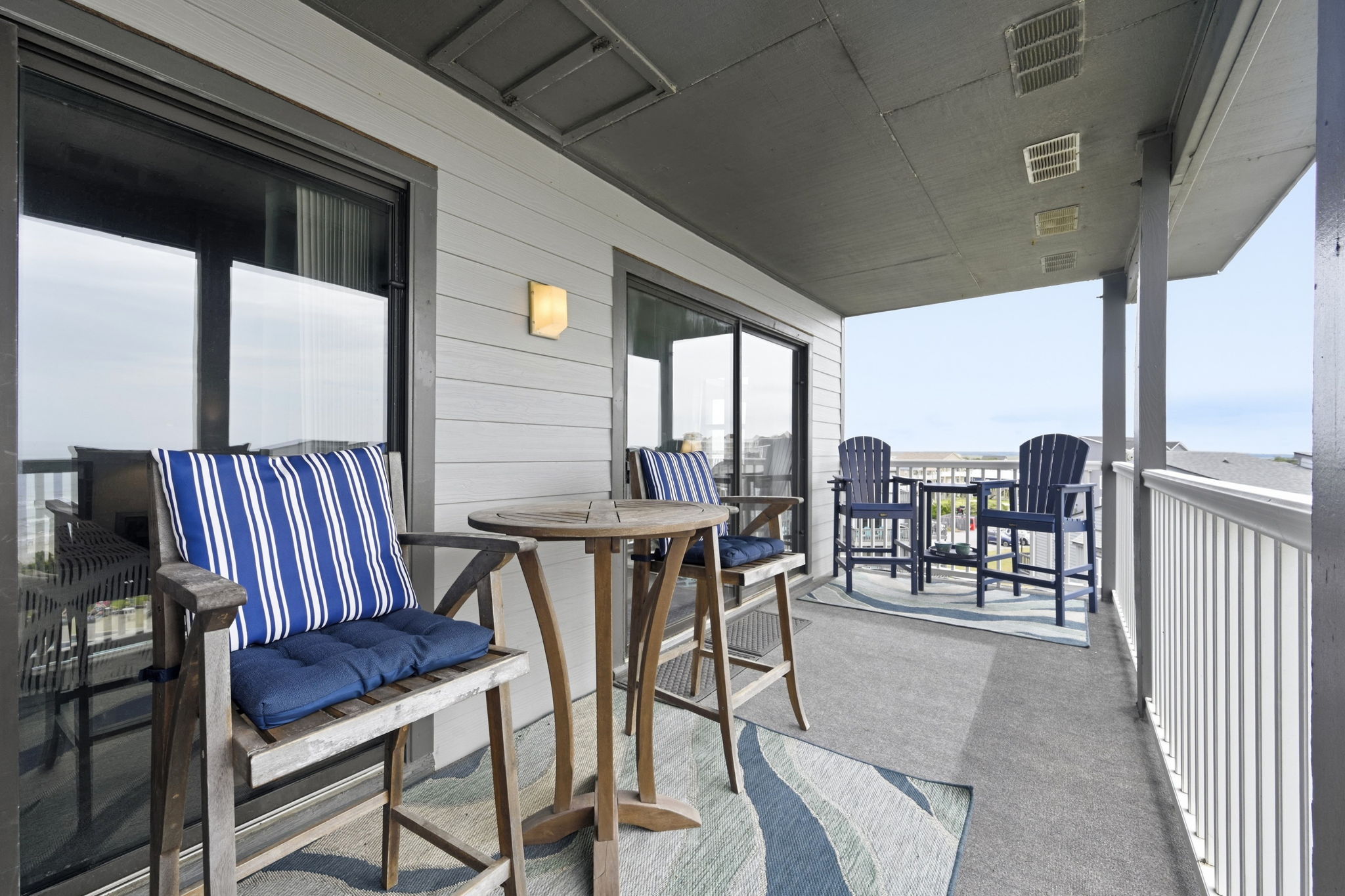 The balcony you'll never want to leave—complete with ocean views and overlooking the sparkling pool.