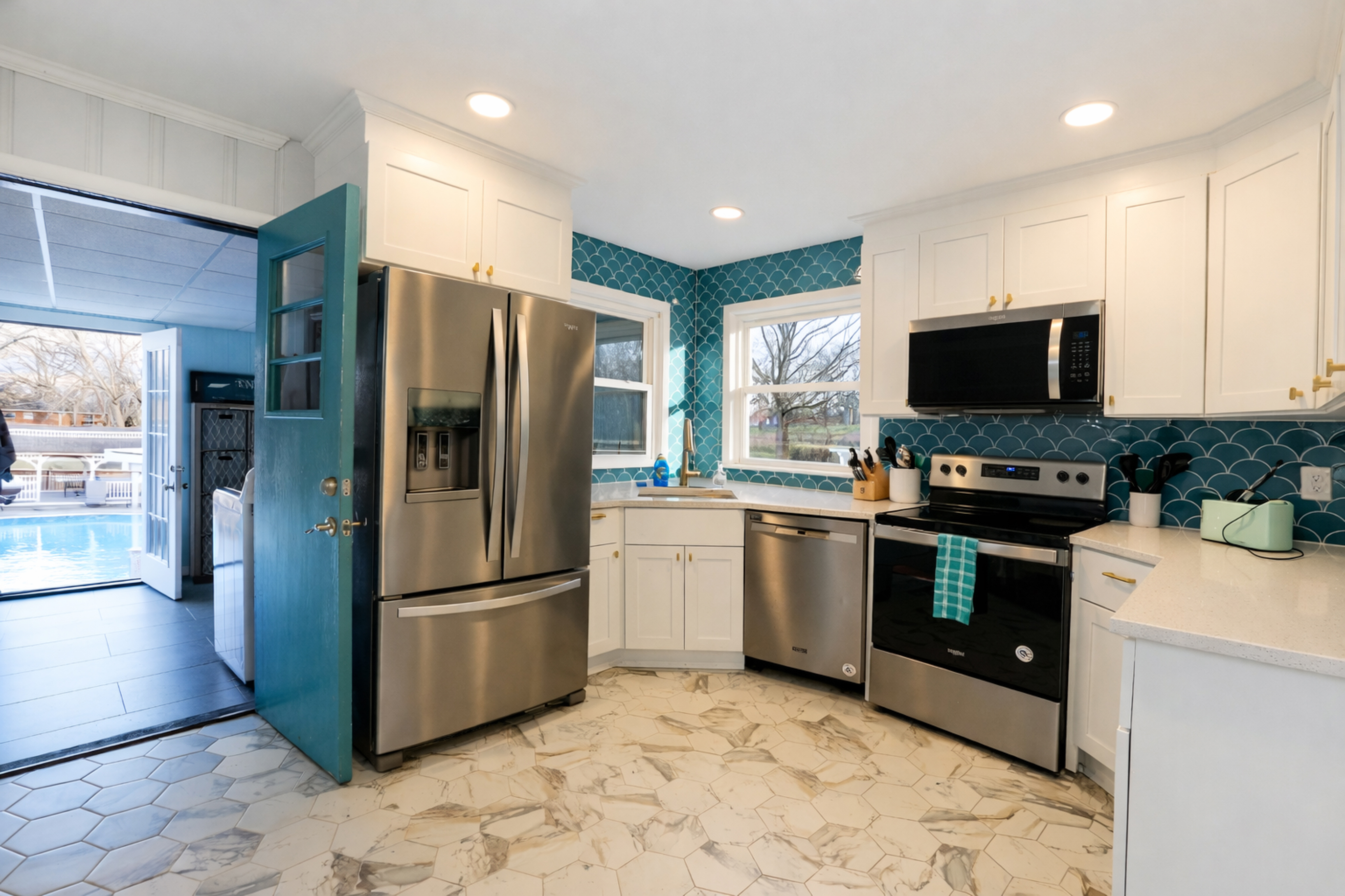 Trendy touches in this historic Ranch! Did you spot the mermaid tile!