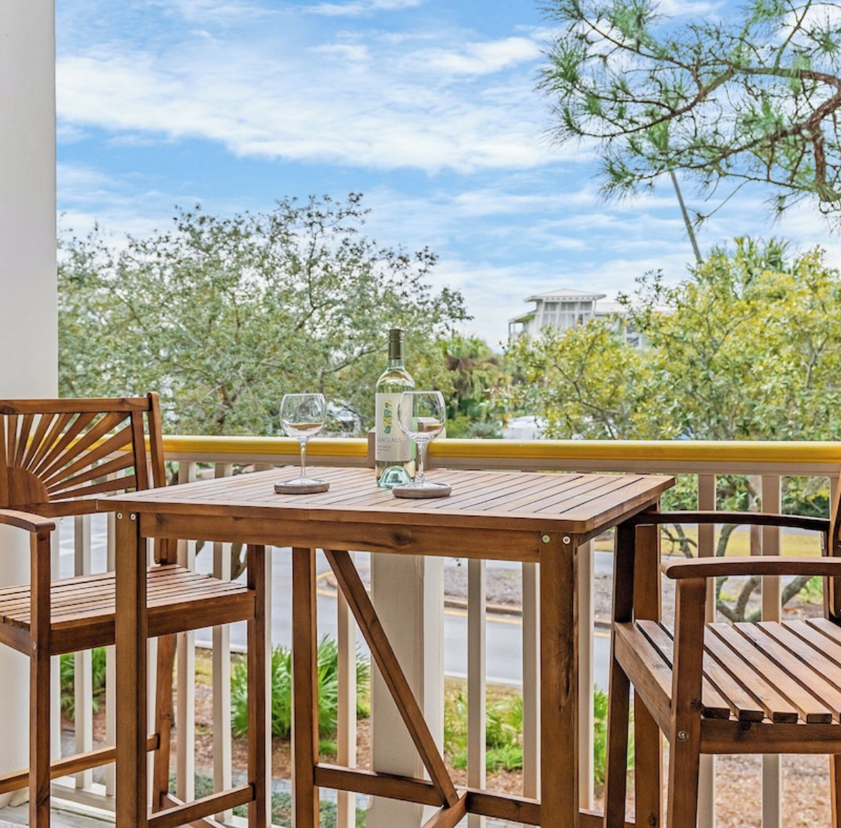 Enjoy wine on your private balcony overlooking Watercolor gardens 